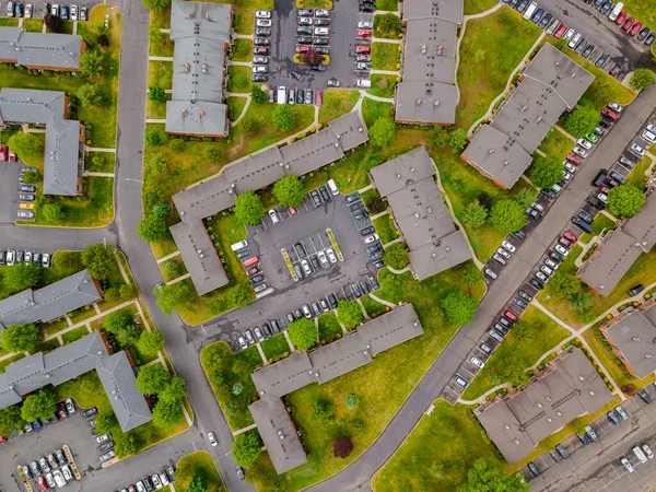Stay Home to reduce risk of infection and spreading the virus, car parking lot viewed from above in the of residential district with apartment buildings