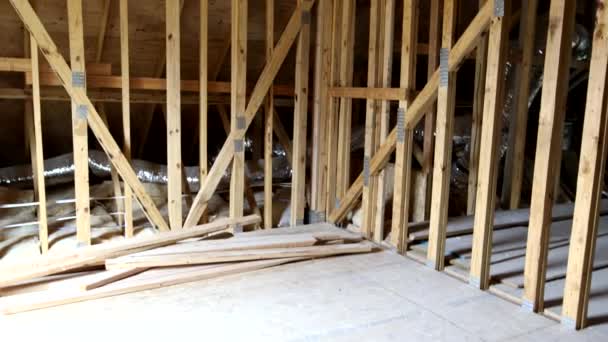 House attic under construction walls and ceiling material in wooden frame — Stock Footage House attic under construction walls and ceiling material in wooden frame Royalty Free Stock Footage