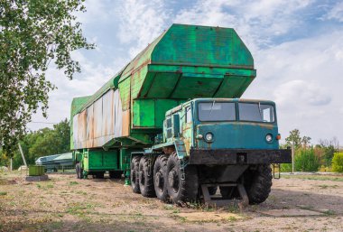 Pobugskoe, Ukraine 09.14.2019. Rocket SS 18 Satan transporter to the launch mine in Soviet Strategic Nuclear Forces Museum, Ukraine, on a sunny day clipart