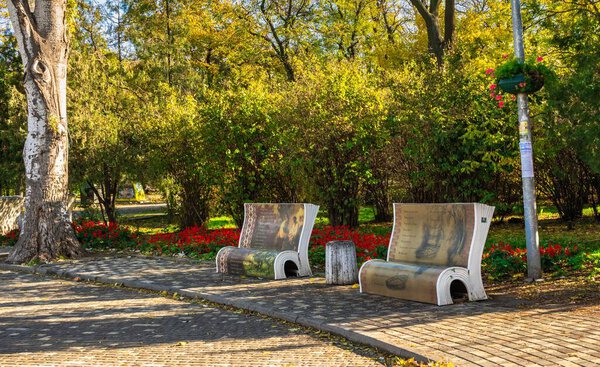 Odessa, Ukraine 11.05.2019.  Artistically designed street benches in Shevchenko Park in Odessa, Ukraine, on a sunny autumn day