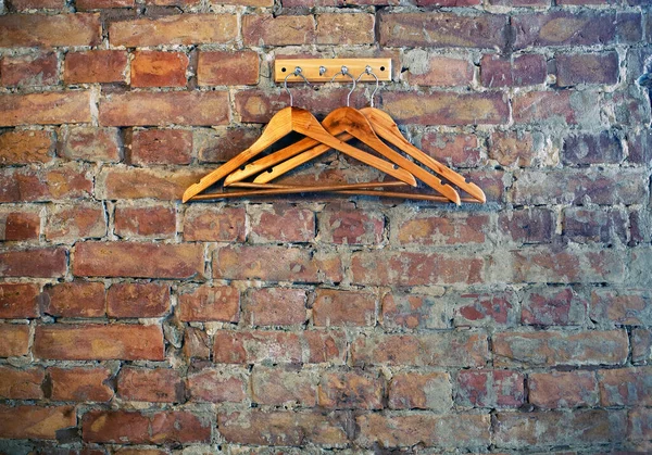 Bricks Wall Background Rack Wooden Clothes Hangers Cafe Restaurant Wardrobe — Stock Photo, Image