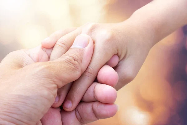 father giving hand to a child