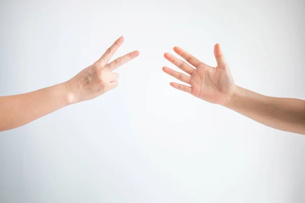 Scissors symbol and paper symbol in playing rock paper scissors game on white background. — Stock Photo, Image