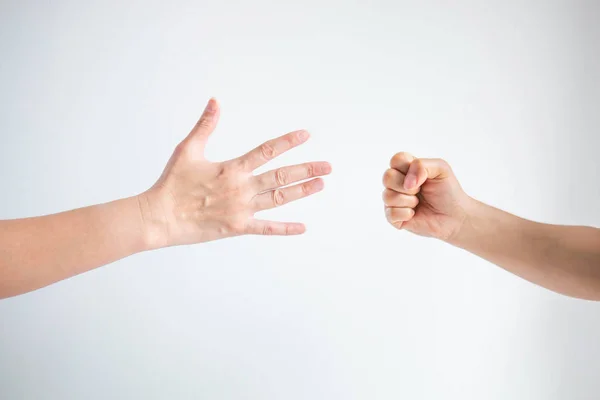 Paper symbol and rock symbol in playing rock paper scissors game on white background.