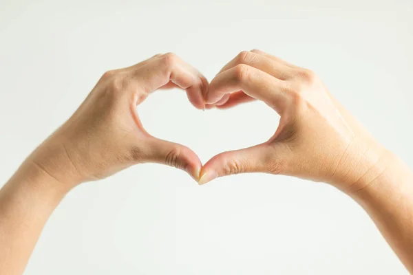 Hands display love sign by splice fingertips together to be heart frame. — Stock Photo, Image