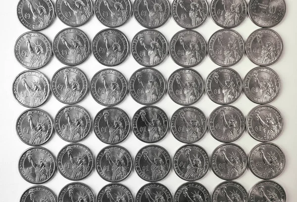 Dark gray background. Coins of one US dollar are laid out in the entire field of the screen. View from top. Black and white. — Stock Photo, Image