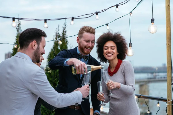 Happy Group Friends Celebrating Rooftop Stock Image