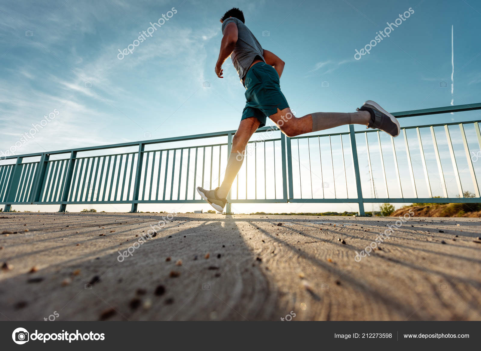 Low Angle Shot Man Running Outdoors Stock Photo C Bernardbodo