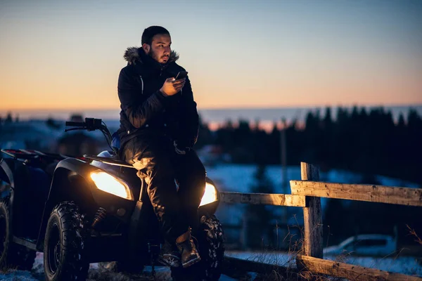 Portrait Young Man Sitting Quad Bike Using Mobile Phone — Stock Photo, Image