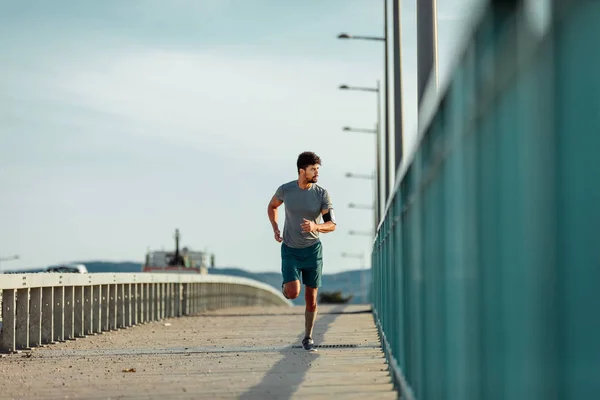 Young Man Running Bridge — Stock Photo, Image