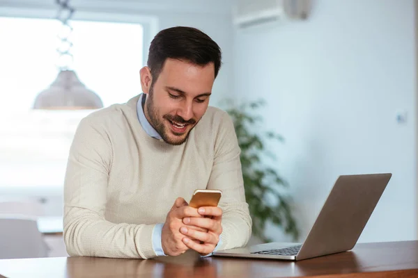 Young Man Working Both His Phone His Laptop Comfort His — Stock Photo, Image
