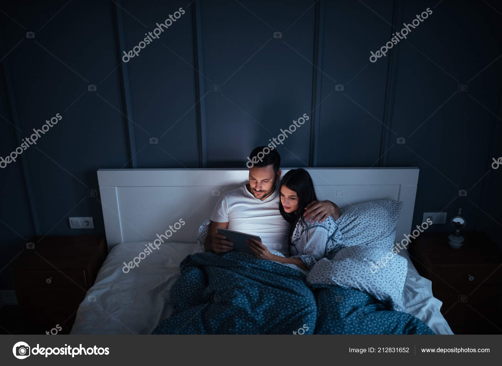 Cute Young Couple Watching Movie Tablet While Bed Night