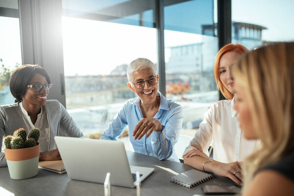 Four multinational businesswoman having a meeting