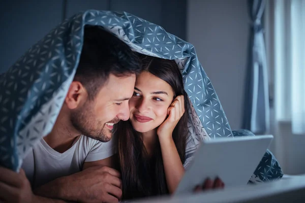 Happy Couple Lying Bed Covers While Watching Romantic Film Tablet — Stock Photo, Image