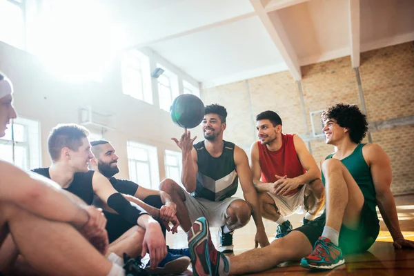 Group of young basketball players having fun with a ball