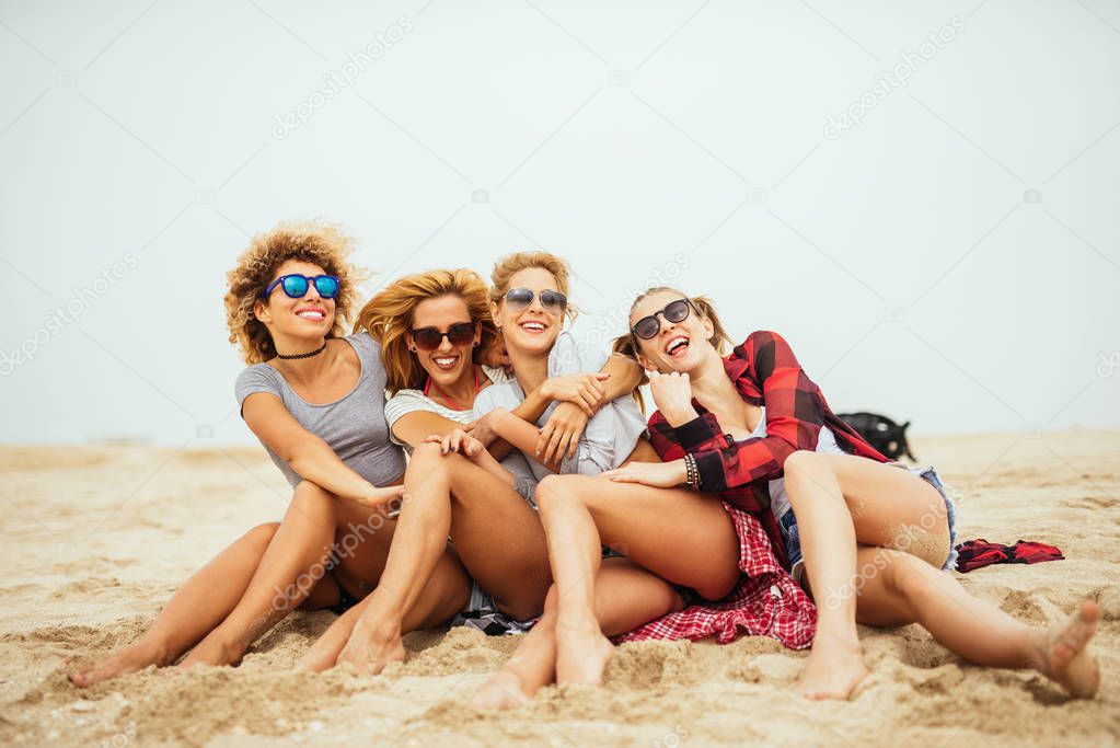 Portrait of girls enjoying spending time together on the beach.