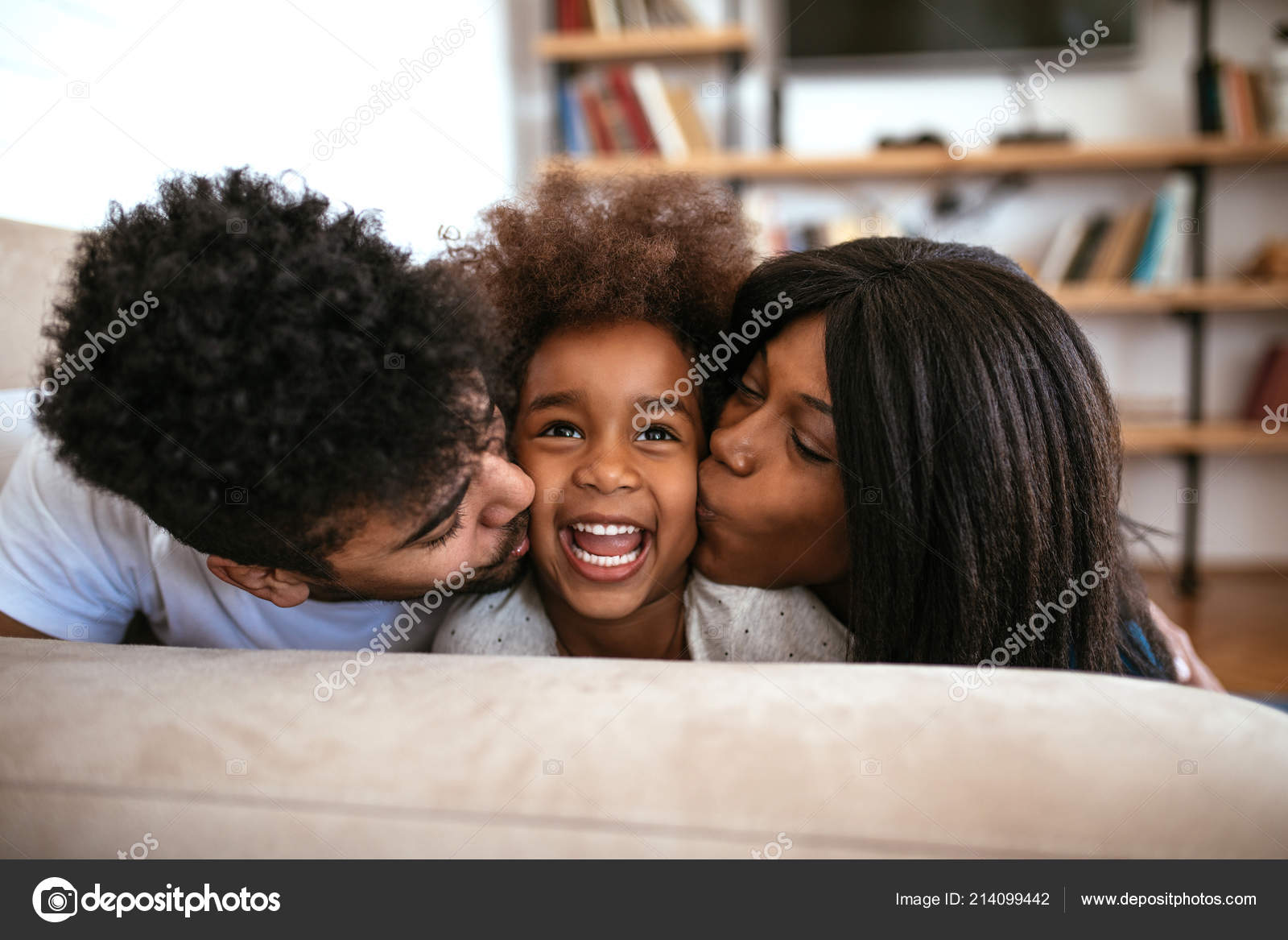 Cute African American Family Sharing Kiss Relaxing Home Stock