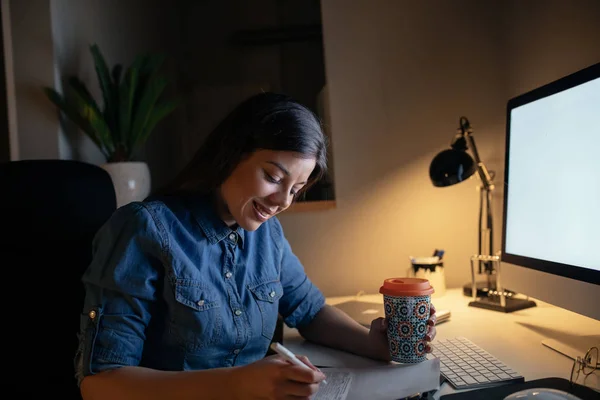 Shot Smiling Young Woman Doing Paperwork Drinking Coffee Late Night — Stock Photo, Image