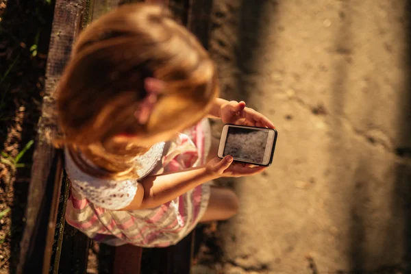High Angle Child Using Mobile Phone While Sitting Park — Stock Photo, Image