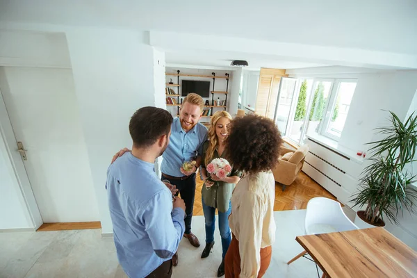 Shot Friends Congratulating New Home Indoors Stock Picture