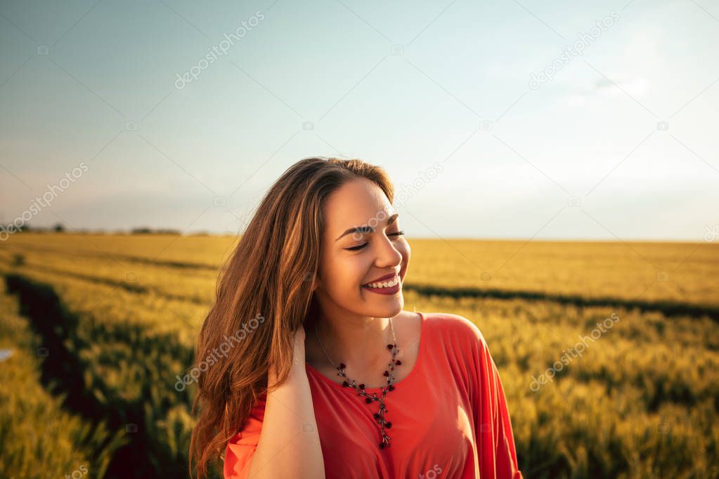 Portrait of a beautiful woman in the field.