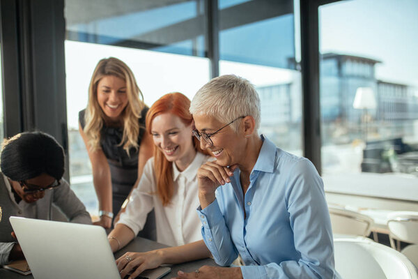 Business women enjoying working together in the office.