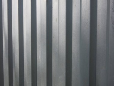 Gri metal sert bir arka plan için tırtıklı yüzey