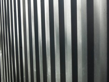 Gri metal sert bir arka plan için tırtıklı yüzey