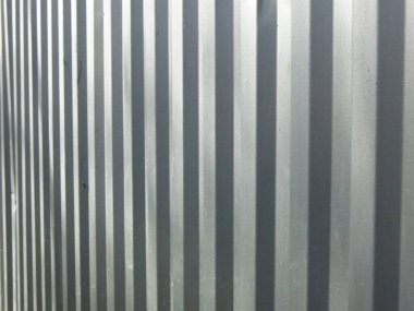 Gri metal sert bir arka plan için tırtıklı yüzey