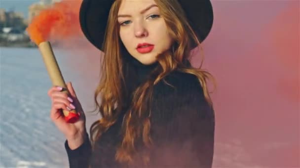 Young woman with two red signal smoke bombs slow motion — Stock Video