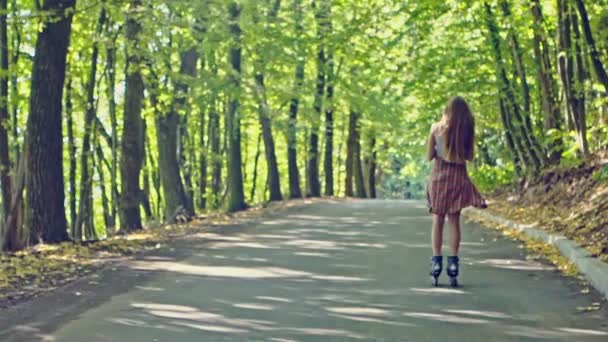 Woman Roller Skates Back Sunny Street Slow Motion — Stock Video