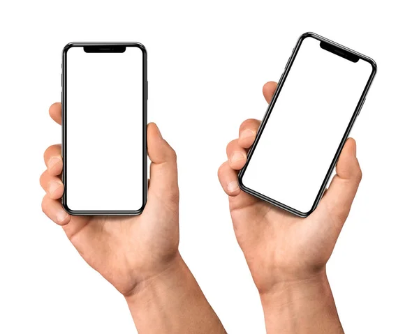 空白の画面とモダンなフレーム少ないデザインで黒いスマートフォンセットを保持する男の手 白い背景に隔離 — ストック写真