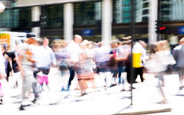 London, UK - 26 June, 2018: Business people and office workers crossing the road. Walking people motion blur. City of London busy business life. clipart