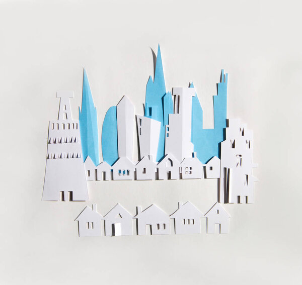 Modern City, skyscrapers and town houses. Property and house buying concept. Paper cut design background.