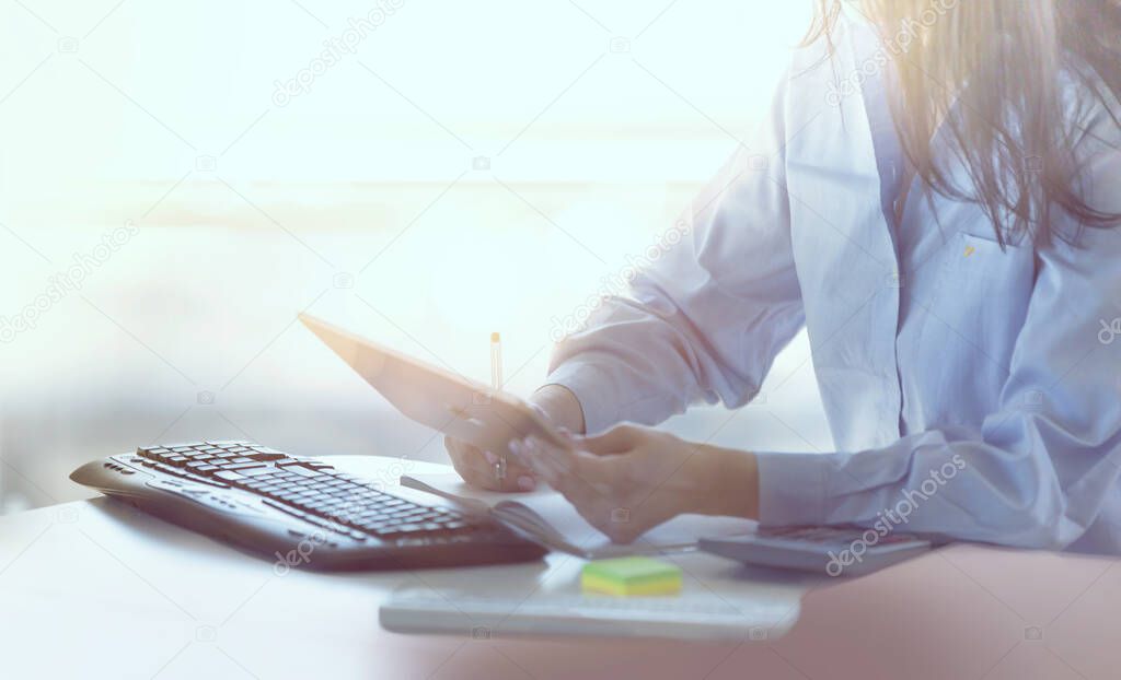 Young business woman working in office by desk. Business concept, work in progress, achievement, support, start up, solving the problems.