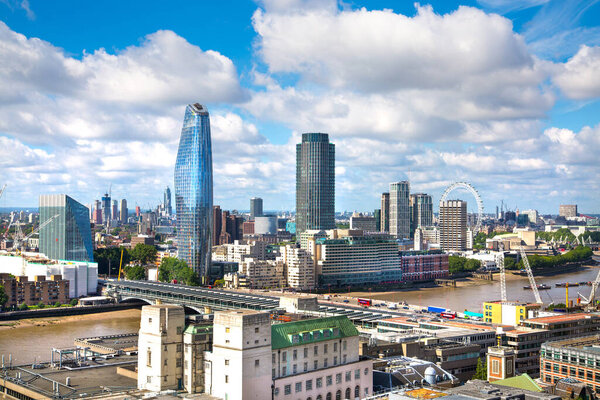 London, UK - June 20, 2019: City of London view at sunny day. View include Office buildings banking and financial district, river Thames and London Bridge