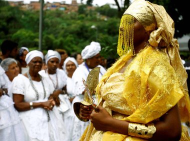 salvador, bahia / brazil - outobro 4, 2014: young man is seen at Parque Sao Bartolomeu in Salvador, wearing costumes from the orixa Oxum, a Candomble entity that reigns in fresh waters.