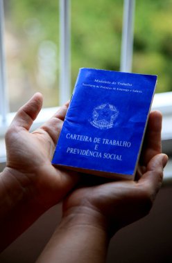 salvador, bahia / brazil - june 12, 2020: brazilian work permit is seen in the city of Salvador. clipart