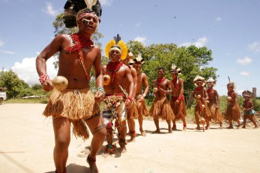 porto seguro, bahia / brazil - december 20, 2010: Pataxo Indians are seen during a protest in a village in the rural area of the city of Porto Seguro, in southern Bahia clipart