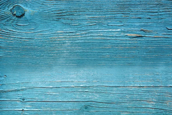 wood textured solid background in blue with knots