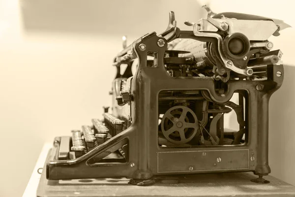 Old typewriter in antique photography vintage simulated. side view. toned filter — Stock Photo, Image