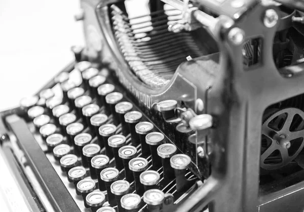 Old typewriter in antique photography vintage simulated. side view. toned filter black-and-white — Stock Photo, Image