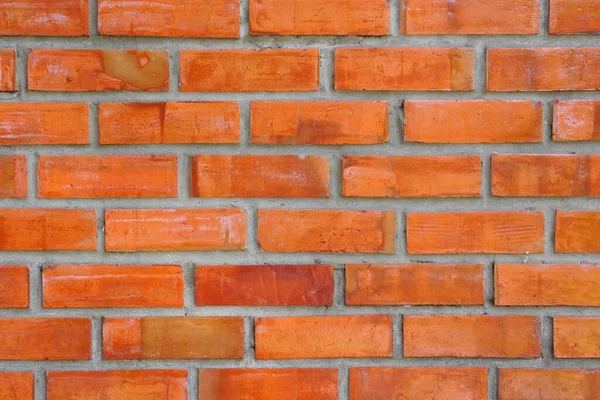 orange with brown brick wall for floor loft and retro style for texture background and wallpaper or interior and exterior construction