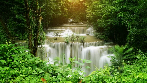 waterfall clear emerald green water on rainy season for holiday relax and summer vacation with tree in jungle or forest at Huay Mae Khamin waterfall floor 4 for nature landscape on warm sunlight
