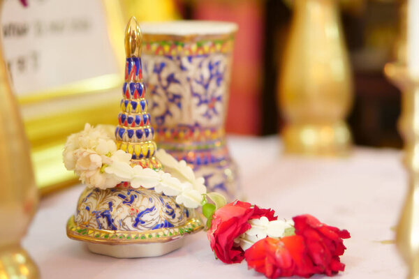 Thai urn or ossuary with red rose flower for 100th anniversary of the death of ancestor
