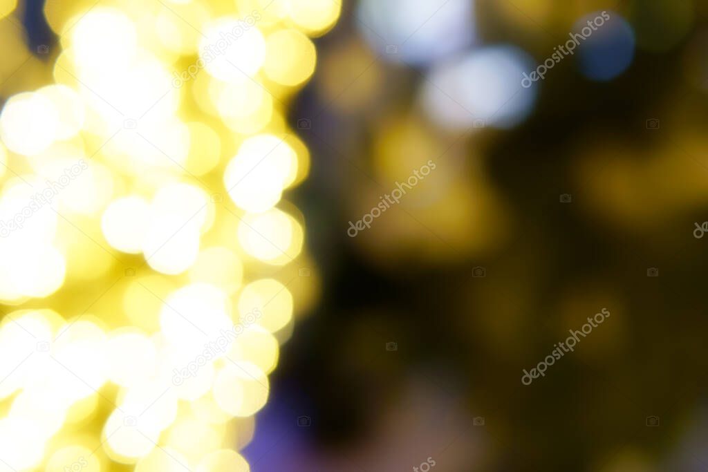 abstract defocused gold bokeh or bubble from light party on stage at night for background and christmas festival with black space