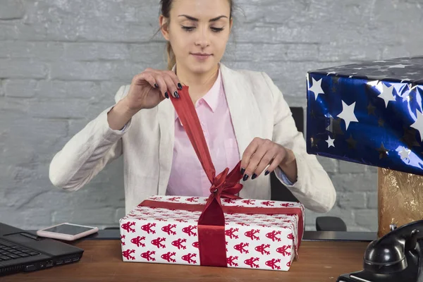 business woman opens her gift