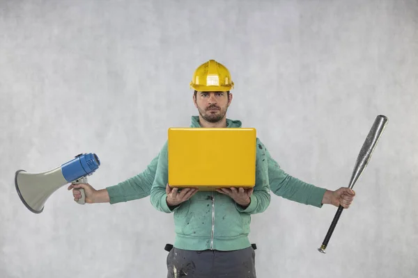 Multitasking construction worker ready for any task, front view — Stock Photo, Image