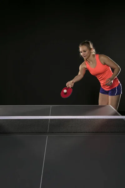 young beautiful athletic girl playing ping pong