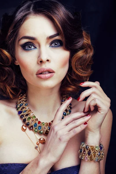 beauty rich woman with bright makeup wearing luxury jewellery lo